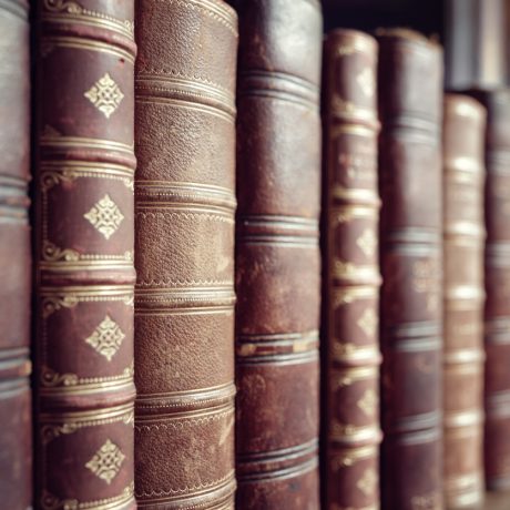 Old leather bound vintage books in a row